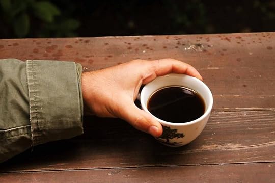 Hand holding a cup of Turkish coffee