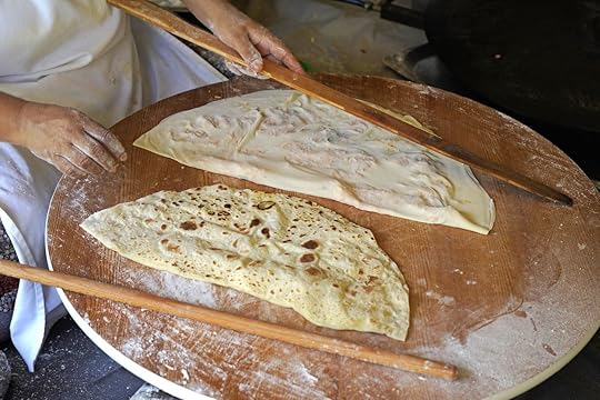 Traditional Turkish stuffed flatbread called Gozleme being made