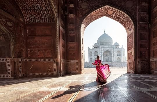 Woman in pink sari at the Taj Mahal in India