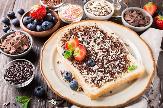 Dutch breakfast, slice of bread with hagelslag chocolate sprinkles and berries