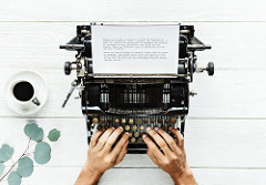 fingers on typewriter