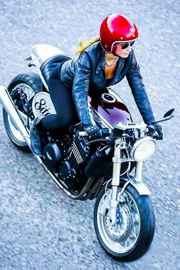 red headed woman on motorcycle