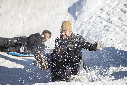 Two people sledding in Prospect Park, Brooklyn
