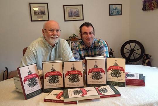 Kyle and son James Pratt with copies of Christmas in Time