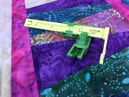 The Ultimate Quilt ‘n Stitch Presser Foot by Nancy Zieman Productions, LLC for Clover available at ShopNZP.com