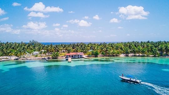 Boat in the water off a beach in Belize