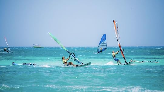 windsurfers in turqoise water in Aruba
