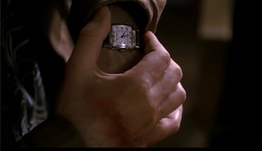 Doyle has a long, horrible bruise on the back of his right hand. He's checking his watch, which shows it's ten, presumably in the morning because of all the sunlight.