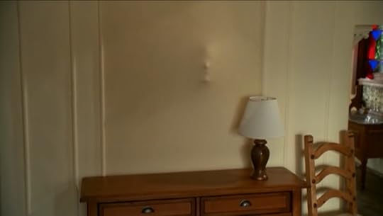 A face pushes out of the wall Cordelia wants to get rid of.