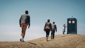 The Doctor and companions approach the TARDIS in 