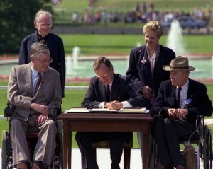 President Bush signs the Americans with Disabilities Act on the South Lawn of the White House,