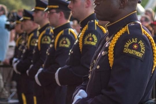 pension admiral police gathered at a vigil honoring the five officers killed in the 7 shootings photo by rear admiral pension uk