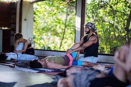 People practicing yoga at Yoga Barn in Bali, Indonesia