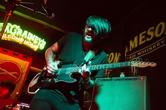 guitarist up on stage at Tom Graineys bar in Boise, Idaho