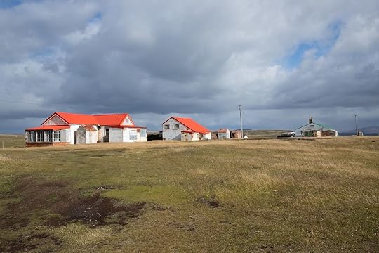 White houses with red roofs in the Pebble Island settlement