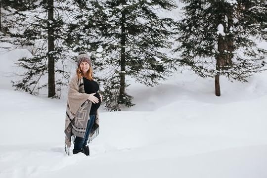 beautiful blonde pregnant woman in the snow