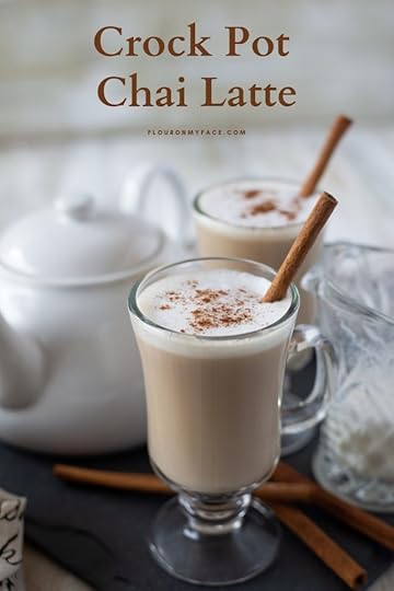 Crock Pot Chai Latte served in a tall mug, topped with frothed milk and garnished with a cinnamon stick.