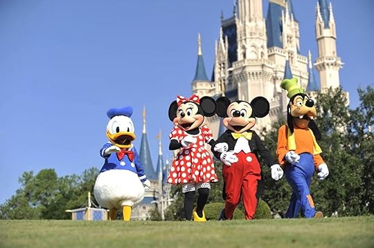 Costumed characters in front of the castle at Walt Disney World