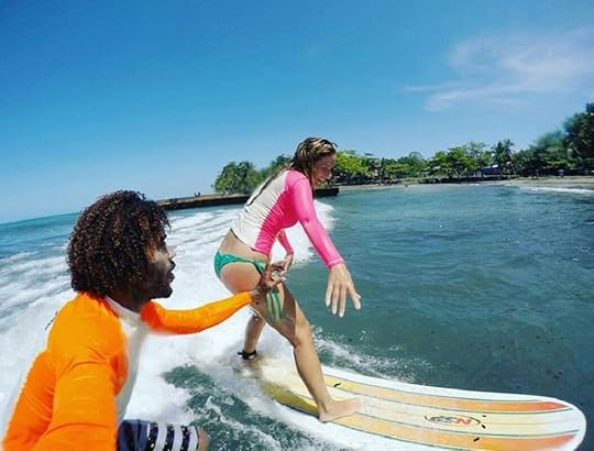 Two people surfing in Costa Rica