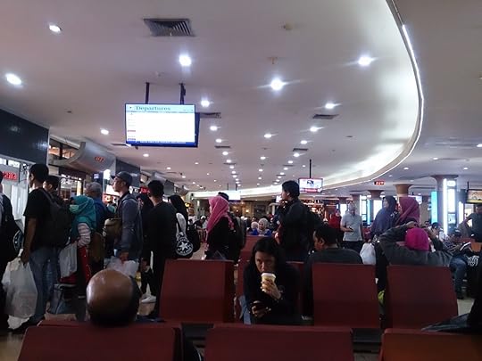Crowd of travelers at Adisutjipto International Airport