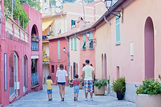 Portrait of family of four, walking on the streets of Villefranche, Nice, France