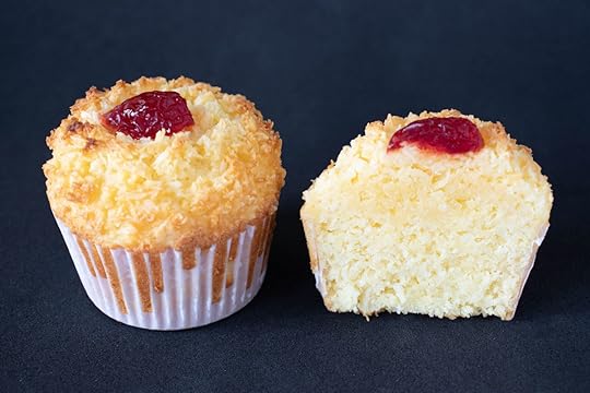 typical sweet brazilian made with cheese, coconuts, eggs, butter, wheat, baking powder and sugar on a black background