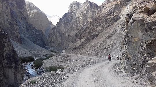 Ride The Himalayas motorcylists traversing a mountain pass