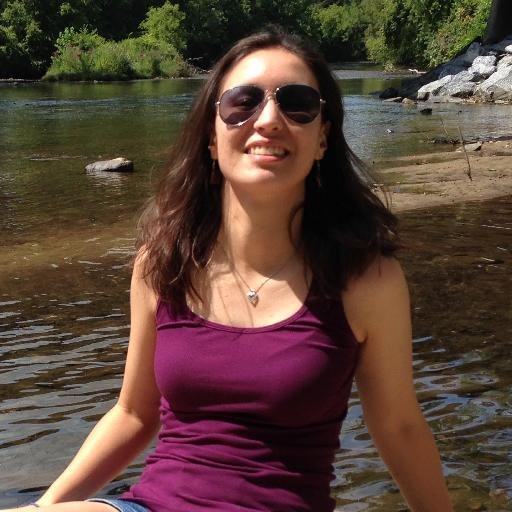 Image: Rebecca with sunglasses in front of creek.