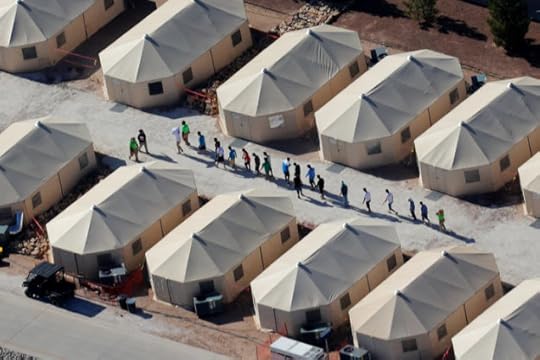 Immigrant children now housed in a tent encampment under the new “zero tolerance” policy by the Trump administration are shown walking in single file at the facility near the Mexican border in Tornillo, Texas, U.S. June 19, 2018. REUTERS/Mike Blake
