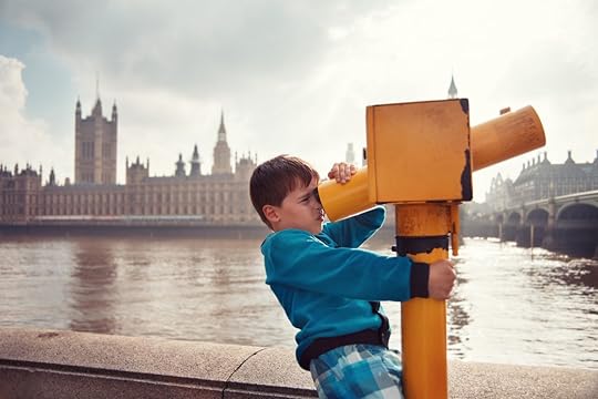 Kid at viewing machine overlooking London
