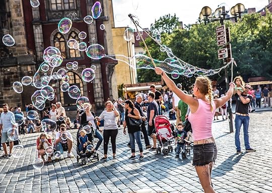 Street Artist making bubbles at Prague Old Town Square