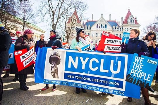 NYCLU volunteers holding signs