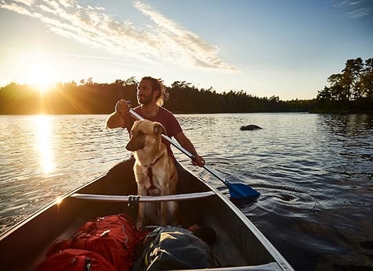 Canoe tour with a dog and a man in sweden