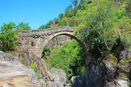 Misarela Bridge surrounded by rocky landscape and green forest in Peneda-Geres National Park, northern Portugal