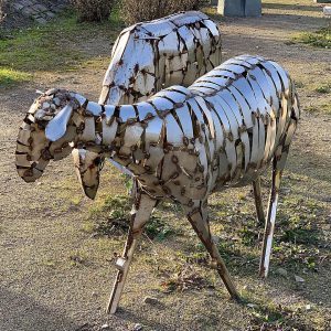 Metal sculpture of two sheep