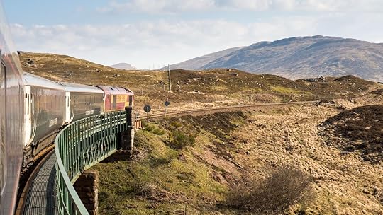 Caledonian Sleeper train crosses Rannoch Viaduct on the scenic West Highland Line railway in the Scottish Highlands