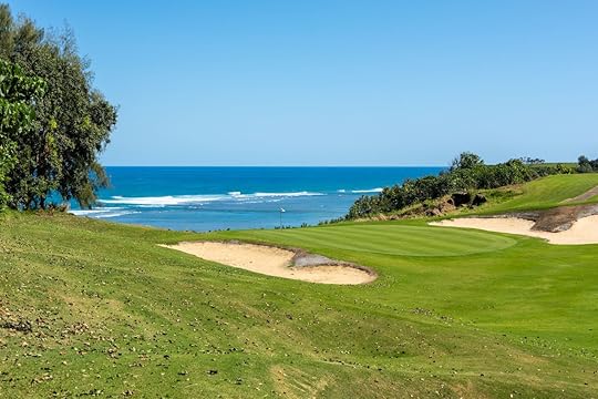 Golf course with a beautiful view of the turquoise ocean on Kauai, Hawaii