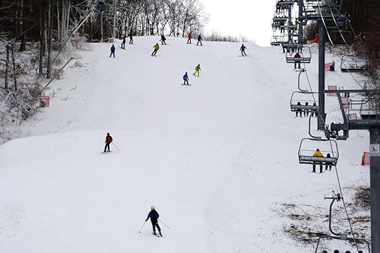 The view of people skiing and riding the ski lift on Shawnee Mountain in the Pokonos
