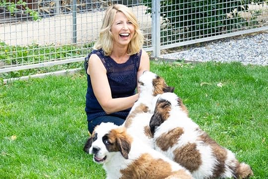Samantha Brown playing with St. Bernard Puppies in Lake Geneva