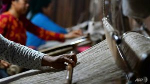 Weavers at textile cooperative in northern Vietnam's Quan Ba district.