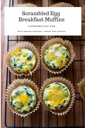 Freshly baked scrambled egg breakfast muffins cooling on a baking rack.