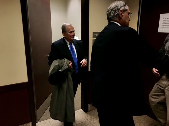 Former state Sen. George Maziarz (left) enters a courtroom