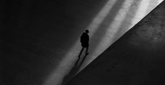 Loneliness epidemic represented by man walking alone