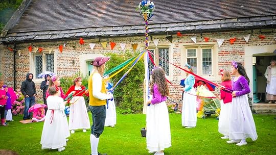 Children are dancing traditional dance at the 18th century street in Milton Abbas village, Dorset, UK