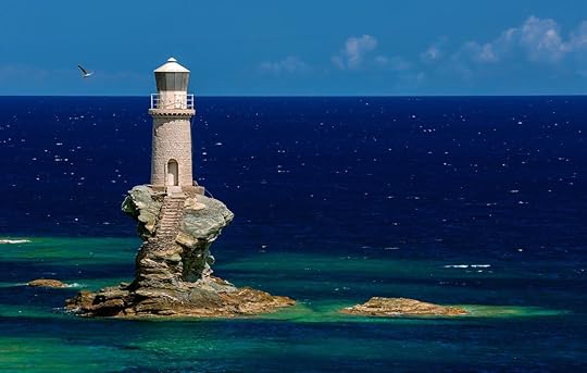 The beautiful Lighthouse Tourlitis of Chora in Andros Island and a Seagull, Cyclades, Greece