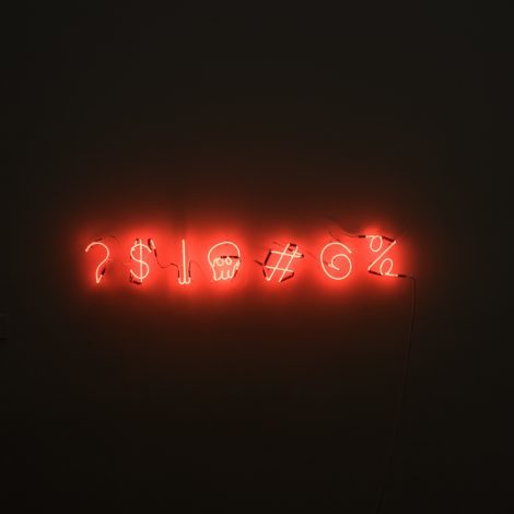 Cryptic characters in neon, a password or curse word