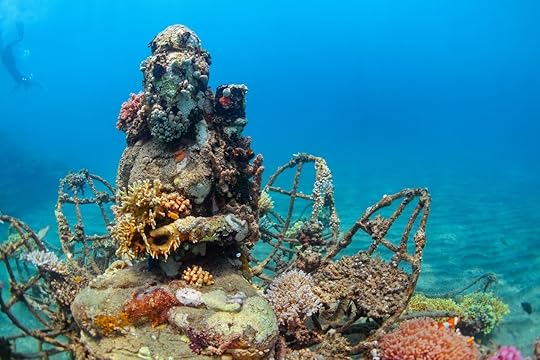 Buddha statue on sea sand bottom in Bali
