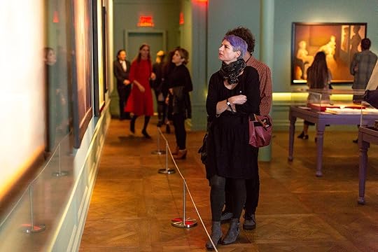 Person looking at art on the wall at the Museum of Sex, New York