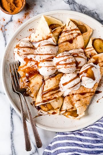 Banana Foster Crepes combine two of my favorite desserts – homemade crepes and bananas fosters! This slimmed down make-over is delicious and perfect anytime you're craving something sweet!