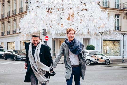Gay couple in Paris in front of Dior boutique